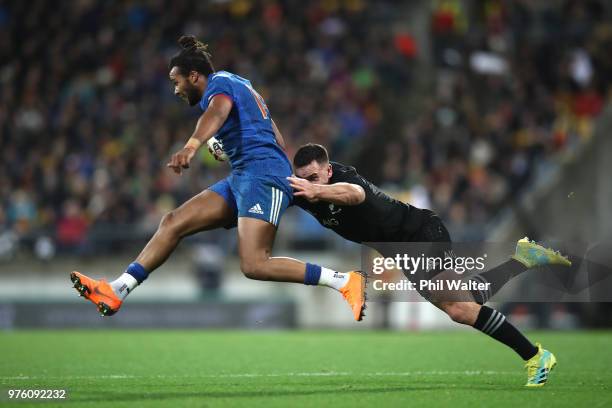 Teddy Thomas of France is tackled by Ryan Crotty of the All Blacks during the International Test match between the New Zealand All Blacks and France...