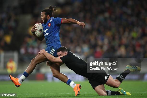Teddy Thomas of France is tackled by Ryan Crotty of the All Blacks during the International Test match between the New Zealand All Blacks and France...