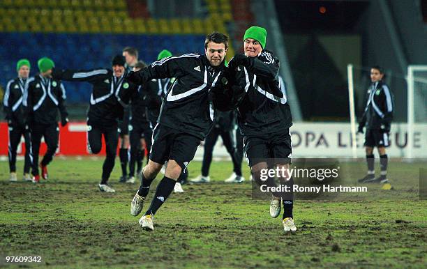 Zvjezdan Misimovic and Marcel Schaefer of Wolfsburg during a training session prior to the UEFA Europa League round of 16 first leg match between...