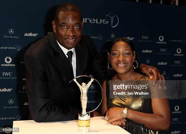 Basketball legend Dikembe Mutombo and his wife Rose Mutumbo arrive at the Laureus World Sports Awards 2010 at Emirates Palace Hotel on March 10, 2010...