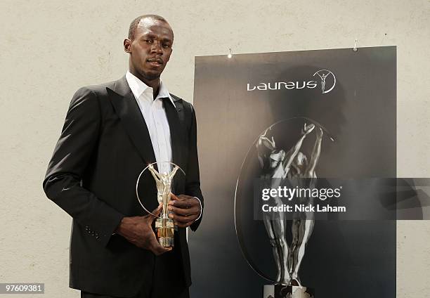 Usain Bolt poses with his Laureus World Sportsman of the Year Award in Kingston, Jamaica for the Laureus World Sports Awards 2010 held at Emirates...