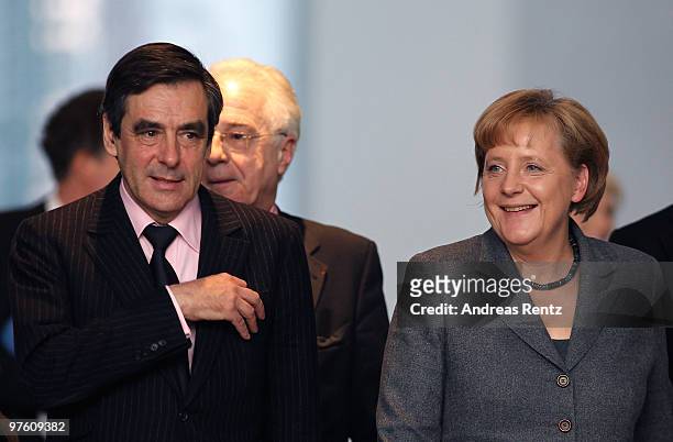 German Chancellor Anglea Merkel and French Prime Minister Francois Fillon arrive for a press conference at the Chancellery on March 10, 2010 in...