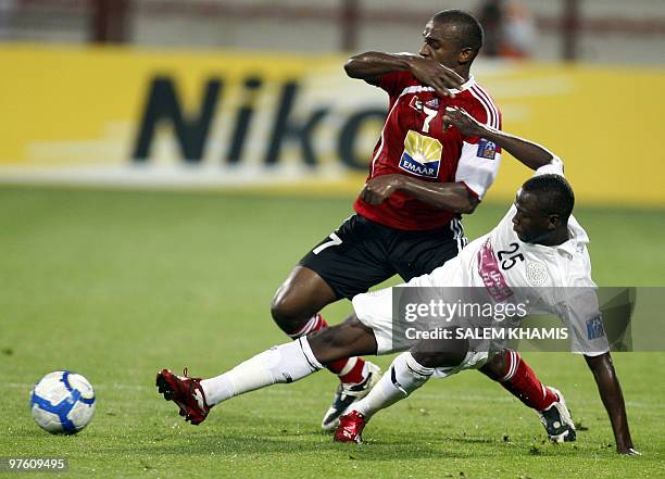 Obaid Khalifa of Emirati Al-Ahli club vies with Yussef Ahmed of Qatar's Al-Sadd club during their AFC Champions League football match in Dubai on...