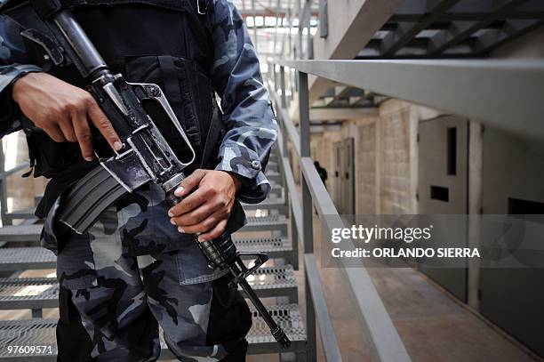 Prison guard in the cell blocks during a visit of Honduran Security Minister Oscar Alvarez to the works of what it will be the maximum security...