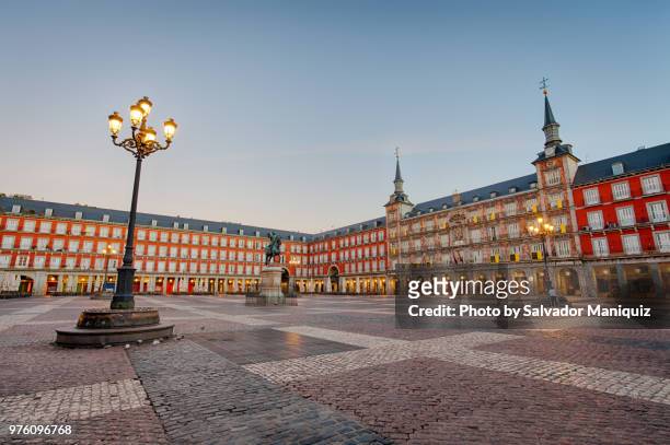 just before sunrise at plaza mayor - madrid landmark stock pictures, royalty-free photos & images
