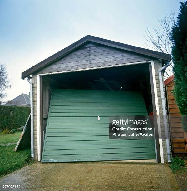 Damaged garage door.