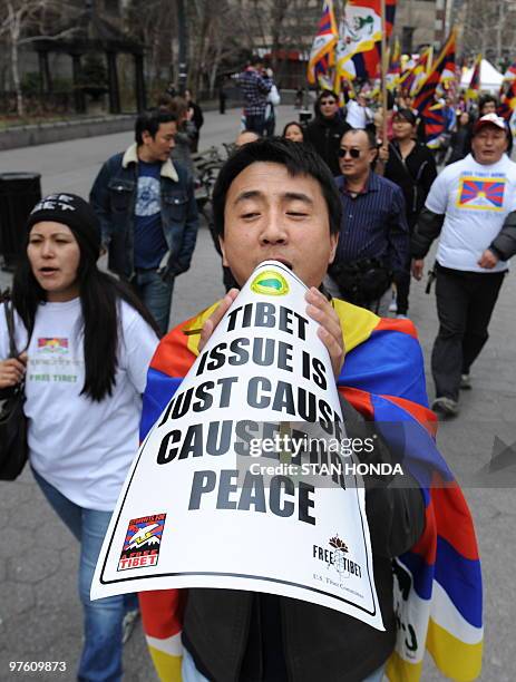 Tibetan protesters and supporters during a rally 10, 2010 across from the United Nations in New York to mark the 51st anniversary of Tibet's 1959...