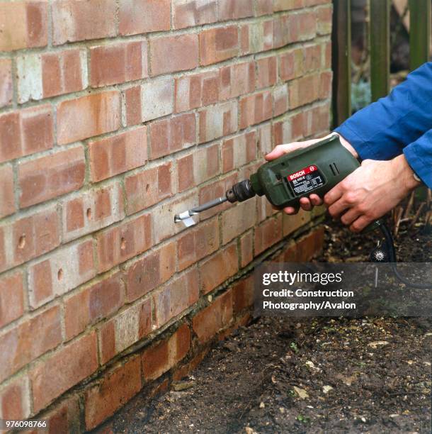 Penetrating damp course applied to an external wall.