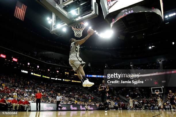 Alec Burks of the Colorado Buffaloes dunks the ball in the first half against the Texas Tech Red Raiders during the first round game of the 2010...