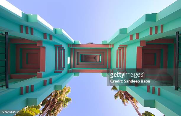upward view at architectural details of building on sunny day, palm court, los angeles, usa - beverly hills california stock-fotos und bilder