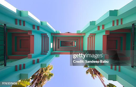 Upward View At Architectural Details Of Building On Sunny Day Palm