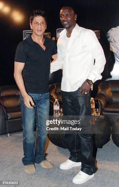 Bollywood star Shah Rukh Khan and singer Akon pose at a news conference for their forthcoming movie "Ra.One" in Mumbai March 9, 2010.