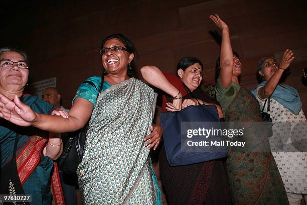 Women activists celebrate the passing of Women's Reservation Bill in Rajya Sabha, in New Delhi on March 9, 2010.