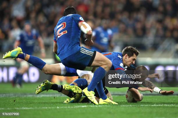 Perenara of the All Blacks is tackled by Baptiste Serin of France during the International Test match between the New Zealand All Blacks and France...