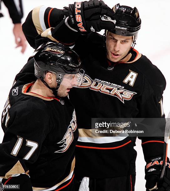 Ryan Getzlaf and Lubomir Visnovsky of the Anaheim Ducks celebrate goal in the third period agins the Columbus Blue Jackets during the game on March...