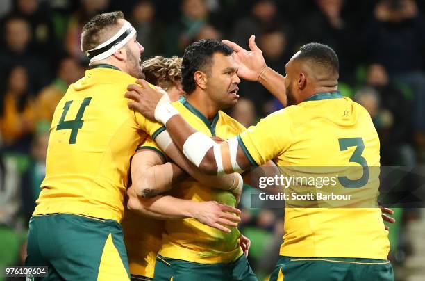 Kurtley Beale of the Wallabies is congratulated by his teammates after scoring a try during the International test match between the Australian...