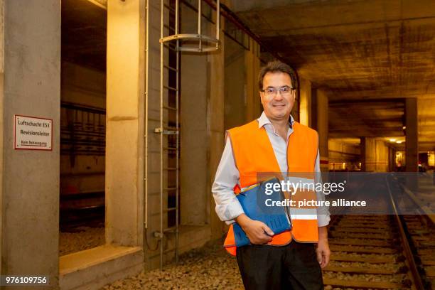 May 2018, Germany, Berlin: Division Manager for Transport Infrastructure at the BVG, Uwe Kutscher, standing in a tunnel behind the U-Bahn station...