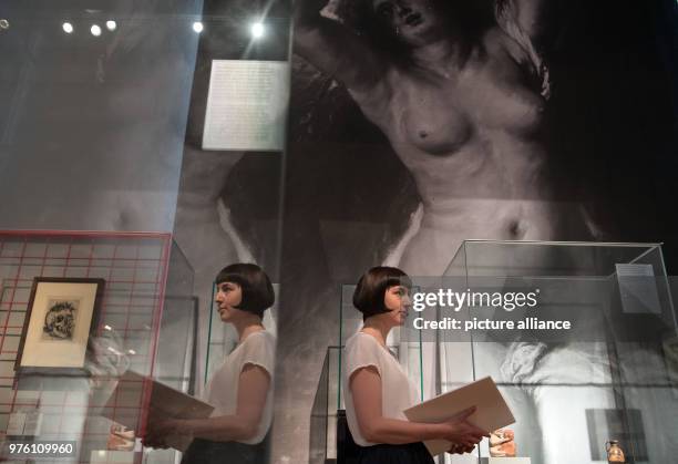 May 2018, Germany, Berlin: A curator of the state museums standing in front of a black and white copy of a clipping of the painting 'Andromeda' by...