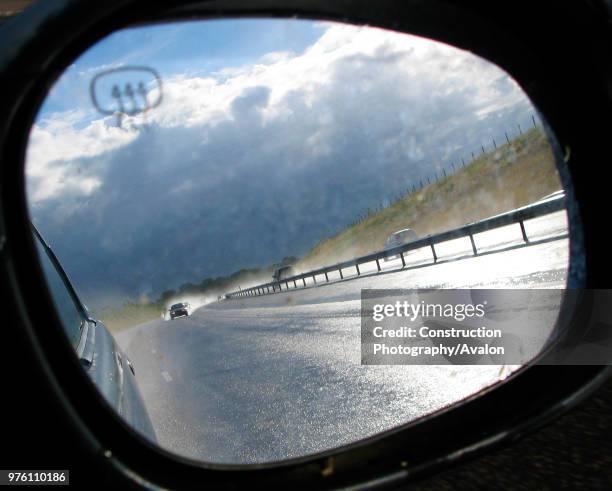 Car mirror on A120, UK.