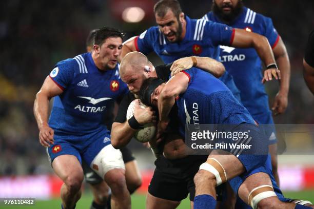 Owen Franks of the New Zealand All Blacks is tackled during the International Test match between the New Zealand All Blacks and France at Westpac...