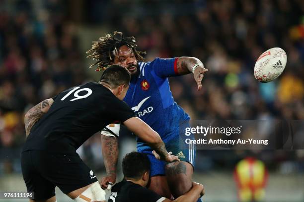 Mathieu Bastareaud of France offloads in a tackle during the International Test match between the New Zealand All Blacks and France at Westpac...