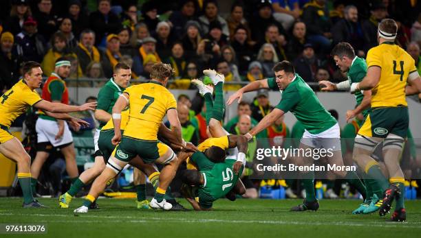 Melbourne , Australia - 16 June 2018; Marika Koroibete of Australia tackles Rob Kearney of Ireland, for which he was shown a yellow card, during the...