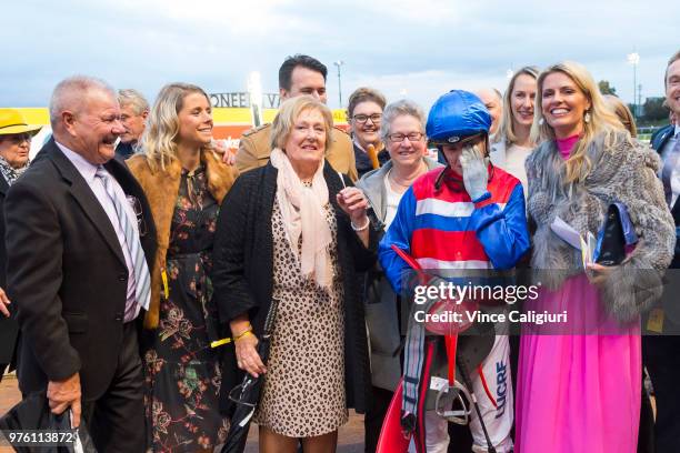 An emotional Craig Williams poses with the Harrison family after riding Magic Consol to win Race 9 , Travis Harrison Cup during Melbourne racing at...