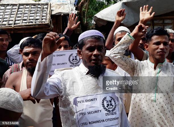 Rohingya refugees stage a demonstration on the day of Eid-ul-Fitr in Kutupalong refugee camp in Cox's Bazar, Bangladesh on June 16, 2018. - As...