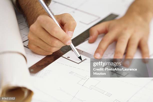 architect editing blueprint, close-up - planalto stock pictures, royalty-free photos & images