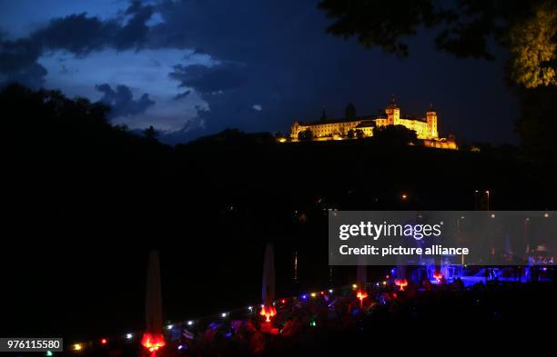 May 2018, Germany, Wuerzburg: Storm clouds move over the Marienberg Fortress and the city shore by the river Main. Photo: Karl-Josef Hildenbrand/dpa