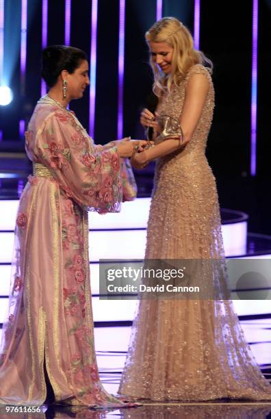Nawal El Moutawakel accepts her " Lifetime Acheivement" award from actress Gwyneth Paltrowon stage during the Laureus World Sports Awards 2010 at...