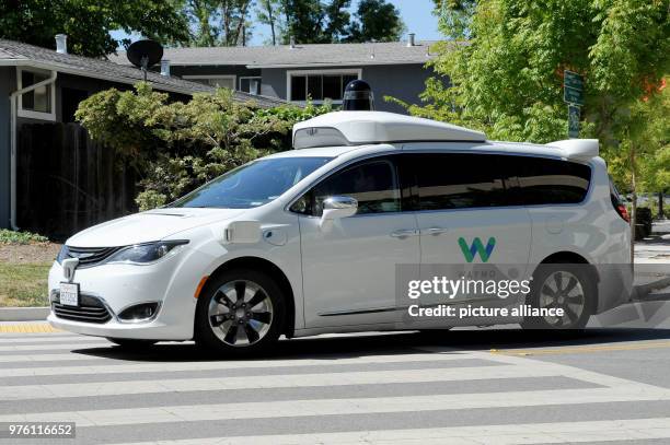 May 2018, US, Mountain View: A self-driving car made by Google's sister company Waymo is on the road for a test drive. The car is a rebuilt minivan...