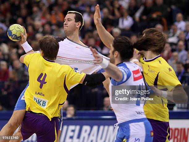 Pascal Hens of Hamburg and Torsten Laen of Berlin compete for the ball during the Bundesliga match between HSV Hamburg and Fuechse Berlin on March...