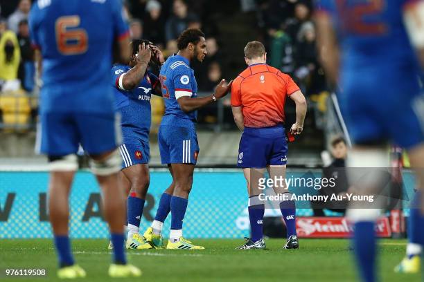 Benjamin Fall of France receives a red card from Referee Angus Gardner as France captain Mathieu Bastareaud reacts during the International Test...