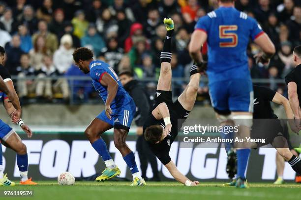 Benjamin Fall of France tackles Beauden Barrett of the All Blacks in the air resulting in a red card from Referee Angus Gardner during the...