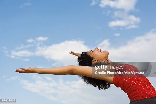young woman bending over backwards, laughing - bending over backwards stock pictures, royalty-free photos & images