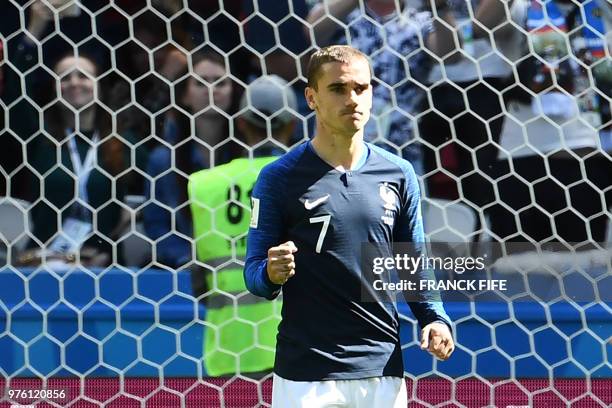 France's forward Antoine Griezmann celebrates a goal after shooting a penalty kick during the Russia 2018 World Cup Group C football match between...