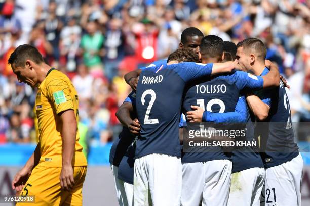 French players celebrate after scoring their first goal on a penalty kick during the Russia 2018 World Cup Group C football match between France and...