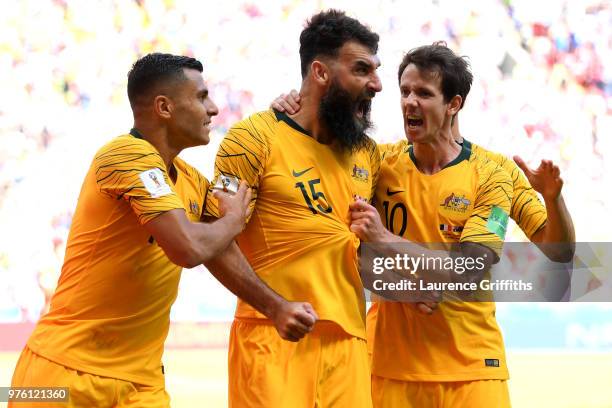 Mile Jedinak of Australia celebrates with team mates after scoring his team's first goal during the 2018 FIFA World Cup Russia group C match between...