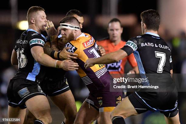 Joshua McGuire of the Broncos is tackled during the round 15 NRL match between the Cronulla Sharks and the Brisbane Broncos at Southern Cross Group...