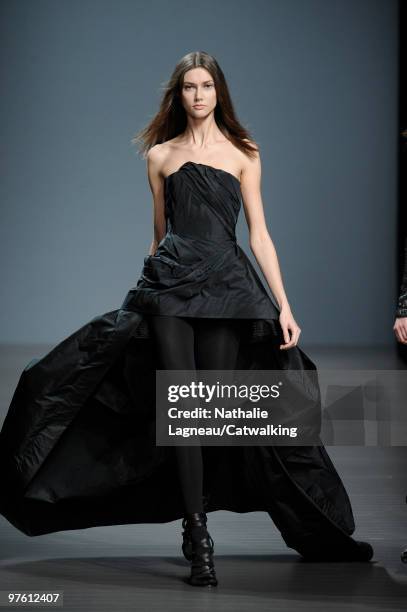 Model walks down the runway during the Valentin Yudashkin fashion show as part of Paris Womenswear Fashion Week Fall/Winter 2011 on March 10, 2010 in...