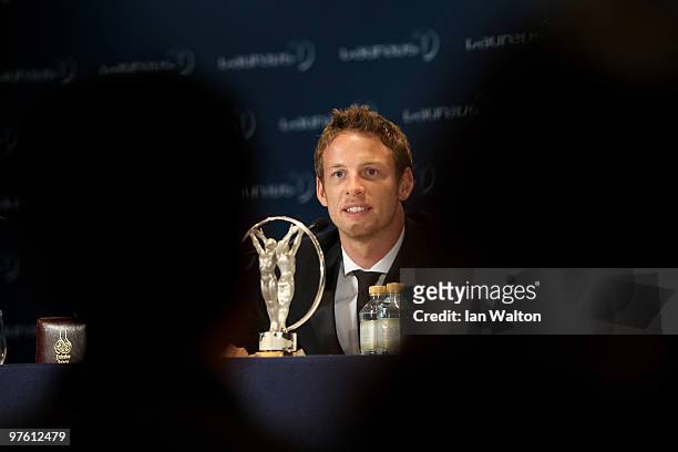 Driver Jenson Button speaks to the media with his award for "Laureus Breakthrough of the Year" in the Awards room during the Laureus World Sports...