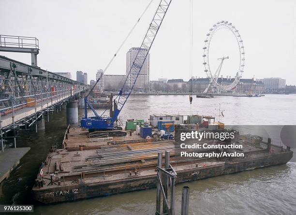 Barges during construction of new Hungerford footbridge London, United Kingdom.