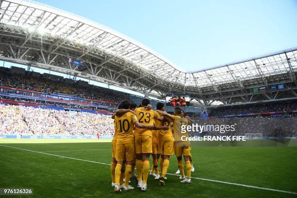 Australia players celebrate a goal after a penalty kick during the Russia 2018 World Cup Group C football match between France and Australia at the...