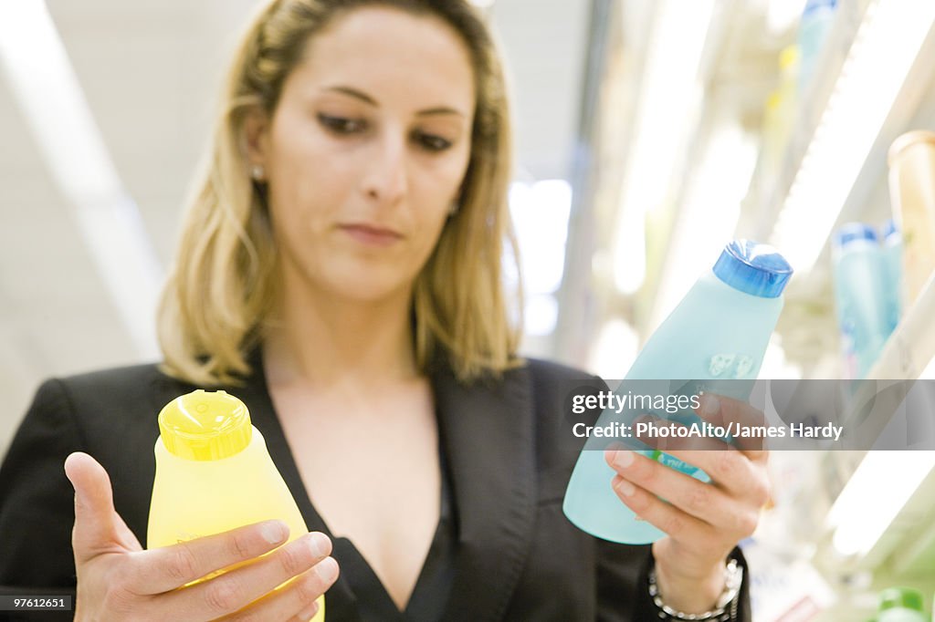Woman comparing body care products
