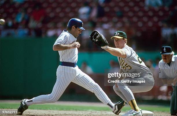 Paul Molitor of the Milwaukee Brewers gets back to first as Mark McGwire of the Oakland Athletics awaits the throw during a May 1989 game at County...
