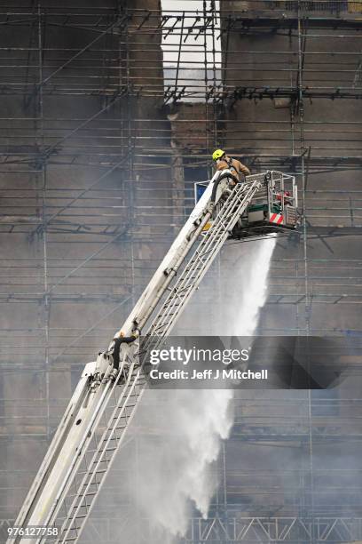 Fire fighters battle a blaze at the Glasgow School of Art for the second time in four years on June 16, Glasgow Scotland. In May 2014 it was...