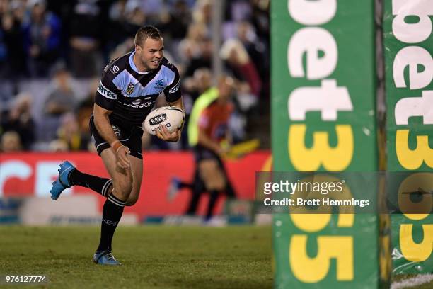 Wade Graham of the Sharks makes a break to score a try during the round 15 NRL match between the Cronulla Sharks and the Brisbane Broncos at Southern...