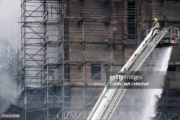 Fire fighters battle a blaze at the Glasgow School of Art for the second time in four years on June 16, Glasgow Scotland. In May 2014 it was...