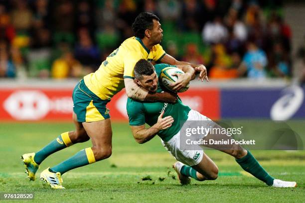 Rob Kearney of Ireland us tackled by Kurtley Beale of the Wallabies during the International test match between the Australian Wallabies and Ireland...
